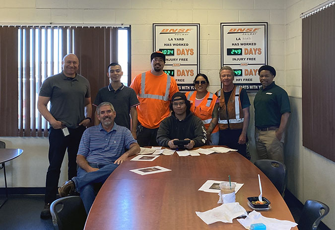 Team members at our Hobart hub celebrate a recent safety success milestone. Standing left to right: Terminal Superintendent Nelson Vargas, Trainmaster Sergio Flores, Conductor Justin Wallace, Engineer Michelle Alcala, Conductor Steve Tate and Assistant Superintendent Elijah Parker. Seated left to right: Terminal Manager Charles West and Conductor Eliseo Ortiz